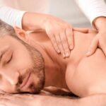 closeup-of-handsome-man-having-full-body-massage-at-male-spa-unrecognizable-female-therapist-rubbing-middle-aged-man-shoulders-making-relaxing-massage-spa-massage-cosmetology-for-men-photo